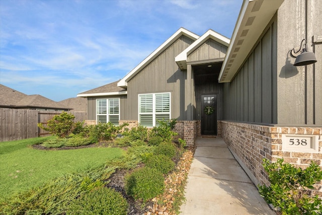 538 Still Water Ridge Ln, Sealy, TX 77474 - property entrance featuring board and batten siding and brick siding