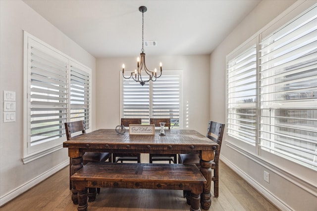 538 Still Water Ridge Ln, Sealy, TX 77474 - dining area with a chandelier, wood finished floors, and baseboards