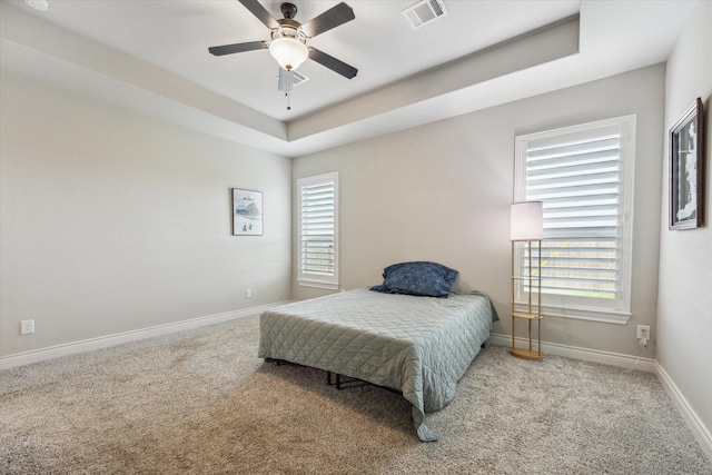 538 Still Water Ridge Ln, Sealy, TX 77474 - bedroom featuring carpet flooring, a raised ceiling, baseboards, and ceiling fan