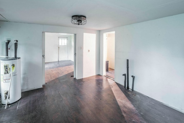 7988 Joy St, Houston, TX 77028 - unfurnished living room with water heater and wood finished floors