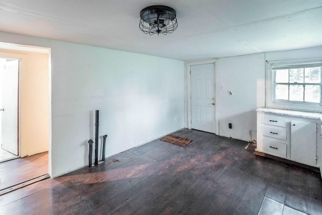 7988 Joy St, Houston, TX 77028 - unfurnished dining area featuring dark wood-style flooring