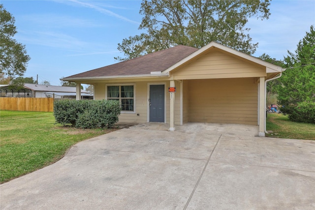 424 Baker Cir, Ames, TX 77575 - view of front of home featuring a shingled roof, concrete driveway, and a carport
