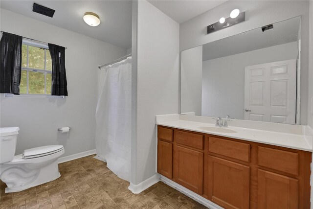 424 Baker Cir, Ames, TX 77575 - bathroom with toilet, vanity, baseboards, and curtained shower