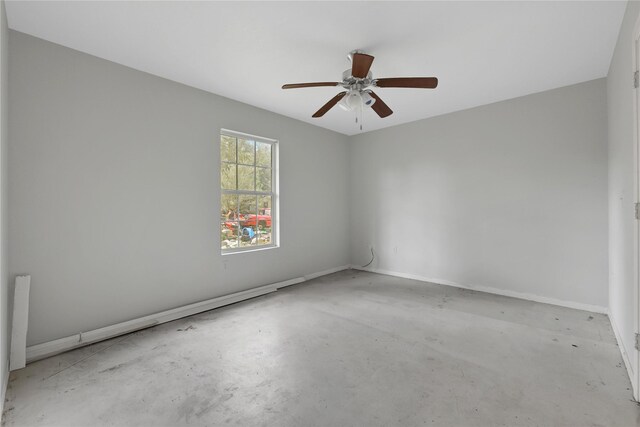 424 Baker Cir, Ames, TX 77575 - unfurnished room with unfinished concrete floors, a ceiling fan, and baseboards