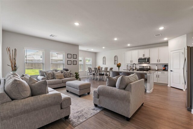 5732 Palm Flower Dr, Montgomery, TX 77316 - living room featuring recessed lighting and wood finished floors