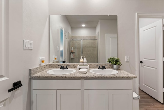 5732 Palm Flower Dr, Montgomery, TX 77316 - full bath featuring a shower stall, double vanity, and wood finished floors