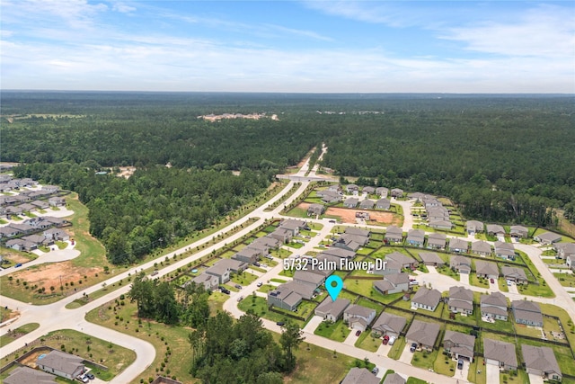 5732 Palm Flower Dr, Montgomery, TX 77316 - aerial overview of property's location with a heavily wooded area and nearby suburban area