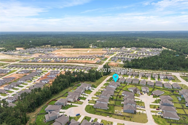 5732 Palm Flower Dr, Montgomery, TX 77316 - aerial overview of property's location featuring nearby suburban area and a heavily wooded area