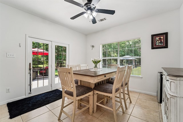 21885 Lost Mdw, New Caney, TX 77357 - dining area with baseboards, ceiling fan, and light tile patterned flooring