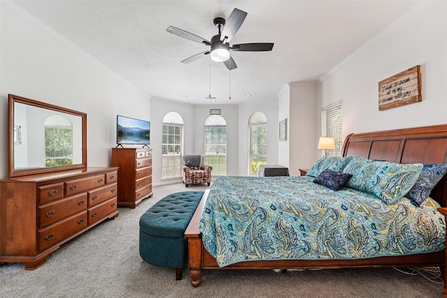 21885 Lost Mdw, New Caney, TX 77357 - carpeted bedroom with multiple windows, crown molding, ceiling fan, and arched walkways