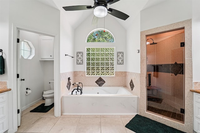 21885 Lost Mdw, New Caney, TX 77357 - full bathroom with vanity, a garden tub, a stall shower, vaulted ceiling, and healthy amount of natural light