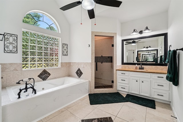 21885 Lost Mdw, New Caney, TX 77357 - bathroom featuring ceiling fan, vanity, a bath, a shower stall, and tile patterned floors
