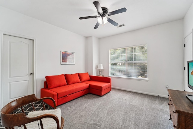 21885 Lost Mdw, New Caney, TX 77357 - carpeted living area featuring baseboards and ceiling fan