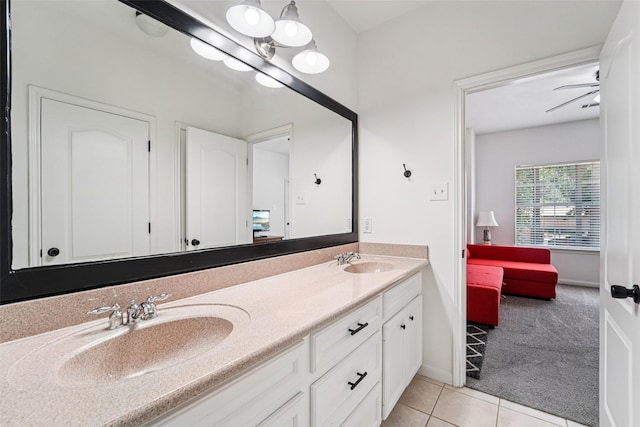 21885 Lost Mdw, New Caney, TX 77357 - bathroom featuring double vanity, ensuite bath, tile patterned flooring, and baseboards