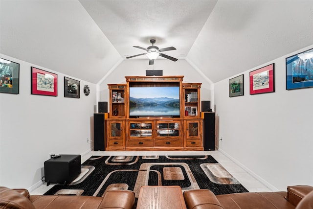 21885 Lost Mdw, New Caney, TX 77357 - home theater room featuring lofted ceiling, ceiling fan, and baseboards