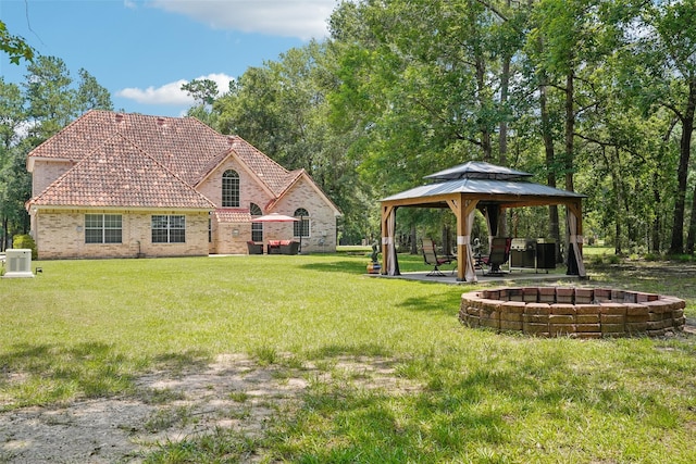 21885 Lost Mdw, New Caney, TX 77357 - view of green lawn featuring a gazebo and central AC