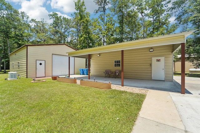 21885 Lost Mdw, New Caney, TX 77357 - view of front of house featuring a front lawn, central AC, an outbuilding, and a patio area