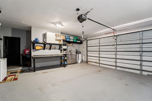 21885 Lost Mdw, New Caney, TX 77357 - garage featuring a garage door opener and stainless steel fridge with ice dispenser