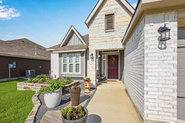 1010 Old Vine Rd, Brenham, TX 77833 - doorway to property featuring central AC and board and batten siding