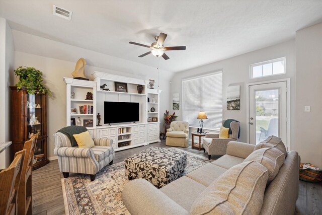 1010 Old Vine Rd, Brenham, TX 77833 - living area with ceiling fan and dark wood-style flooring