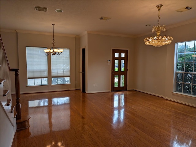 7222 Harmony Cv, Houston, TX 77036 - entryway with a chandelier, stairway, wood finished floors, ornamental molding, and baseboards