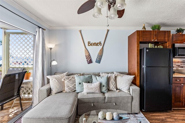 6300 Seawall Blvd Unit 9115, Galveston, TX 77551 - living area with ornamental molding, a ceiling fan, dark wood-type flooring, and a textured ceiling