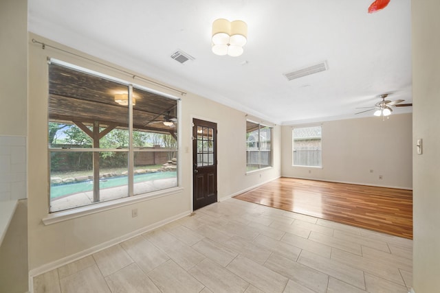 718 Presley Way, Sugar Land, TX 77479 - spare room featuring ceiling fan, baseboards, wood finished floors, and ornamental molding