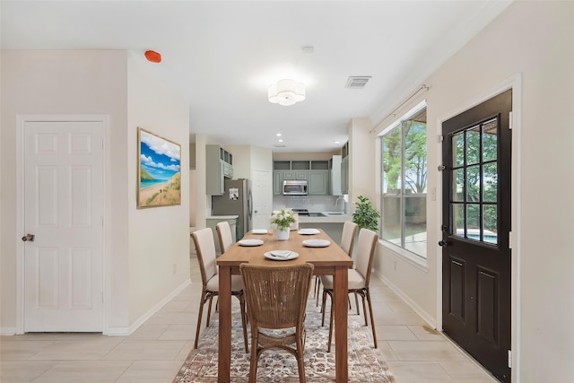 718 Presley Way, Sugar Land, TX 77479 - dining area featuring light tile patterned floors and baseboards