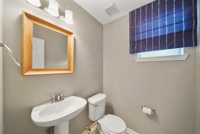 718 Presley Way, Sugar Land, TX 77479 - half bathroom with a sink, toilet, and baseboards