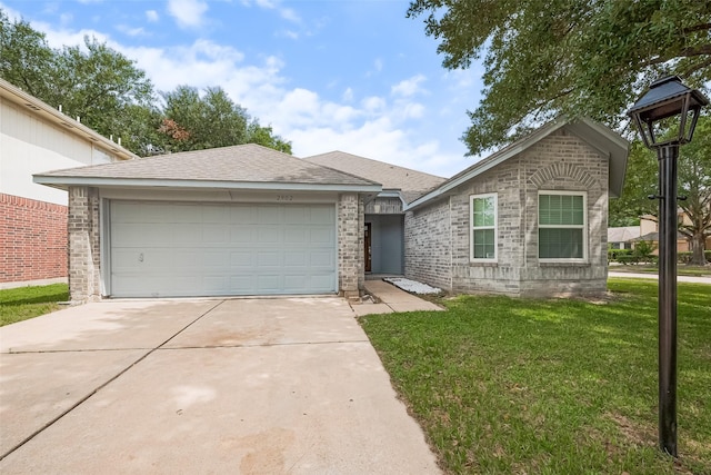 2902 Secluded Dr, Sugar Land, TX 77498 - view of front facade with driveway, a garage, a front yard, and brick siding
