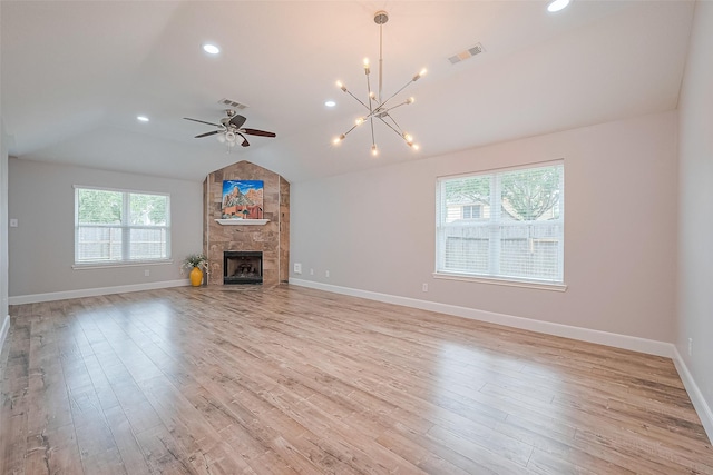 2902 Secluded Dr, Sugar Land, TX 77498 - unfurnished living room with lofted ceiling, a chandelier, light wood finished floors, a fireplace, and baseboards