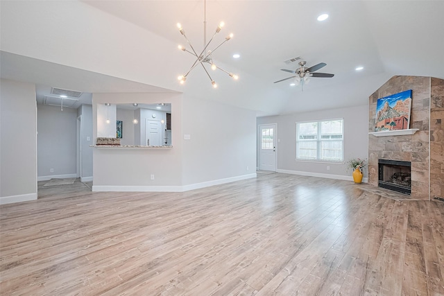 2902 Secluded Dr, Sugar Land, TX 77498 - unfurnished living room with vaulted ceiling, light wood finished floors, baseboards, a fireplace, and ceiling fan