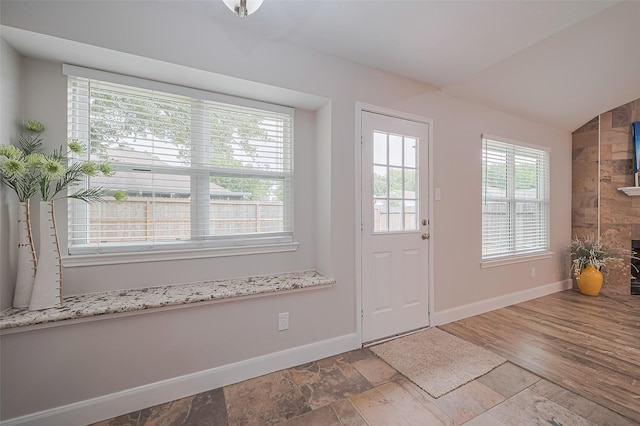 2902 Secluded Dr, Sugar Land, TX 77498 - entryway with baseboards, vaulted ceiling, and stone finish floors