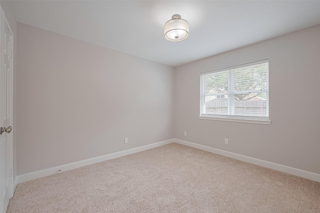 2902 Secluded Dr, Sugar Land, TX 77498 - spare room featuring light colored carpet and baseboards