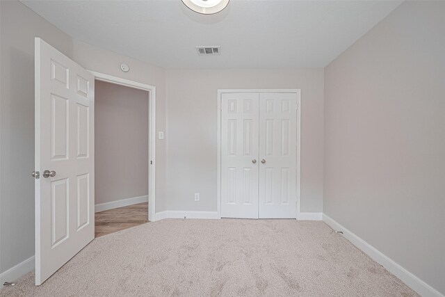2902 Secluded Dr, Sugar Land, TX 77498 - unfurnished bedroom featuring carpet floors, baseboards, and a closet