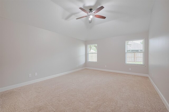 2902 Secluded Dr, Sugar Land, TX 77498 - unfurnished room with lofted ceiling, light carpet, ceiling fan, and baseboards