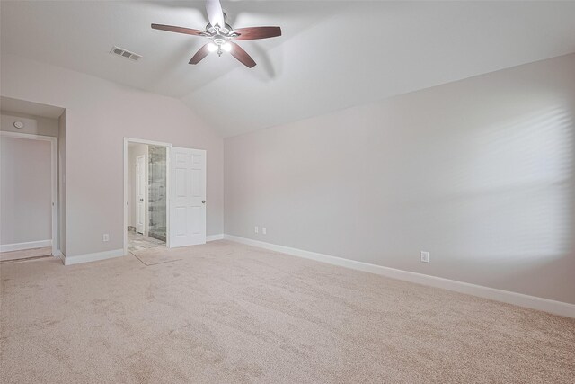 2902 Secluded Dr, Sugar Land, TX 77498 - unfurnished bedroom featuring light carpet, vaulted ceiling, baseboards, connected bathroom, and a ceiling fan