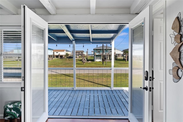 512 Surf Dr, Freeport, TX 77541 - doorway to outside featuring a residential view and beam ceiling
