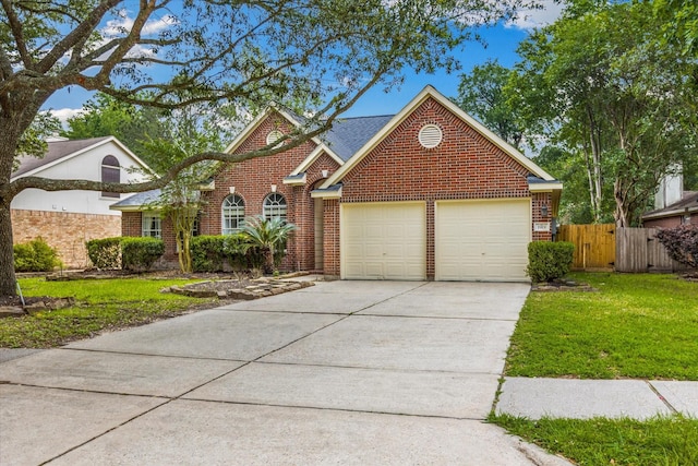 1919 W Welsford Dr, Spring, TX 77386 - traditional-style home with brick siding, driveway, and an attached garage