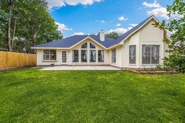 1919 W Welsford Dr, Spring, TX 77386 - rear view of property featuring a patio area, a chimney, and a shingled roof