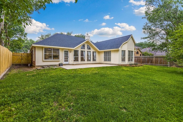 1919 W Welsford Dr, Spring, TX 77386 - back of property with a patio, a chimney, and roof with shingles