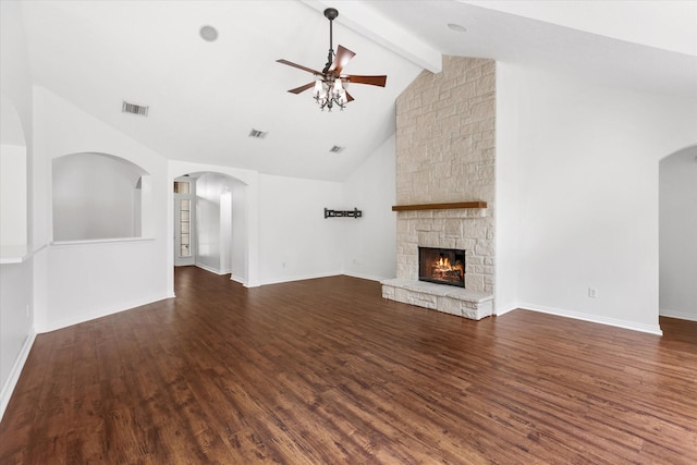 1919 W Welsford Dr, Spring, TX 77386 - unfurnished living room featuring ceiling fan, beam ceiling, dark wood-type flooring, a fireplace, and baseboards