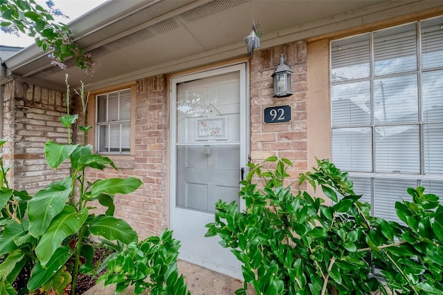 1016 Tri Oaks Ln Unit 92, Houston, TX 77043 - property entrance featuring a porch and brick siding
