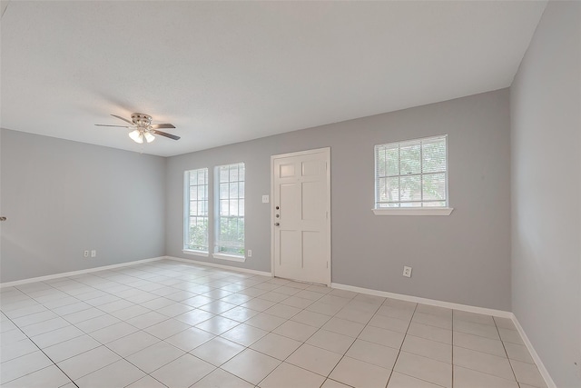 1016 Tri Oaks Ln Unit 92, Houston, TX 77043 - unfurnished room with ceiling fan, light tile patterned flooring, and baseboards