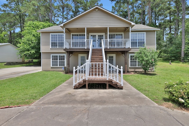 360 Holiday Ln, Coldspring, TX 77331 - view of front of property with a front lawn and stairs