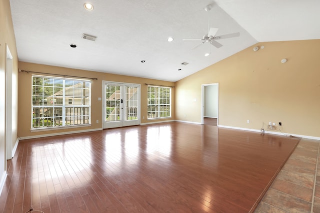360 Holiday Ln, Coldspring, TX 77331 - unfurnished living room featuring lofted ceiling, wood finished floors, baseboards, a ceiling fan, and recessed lighting