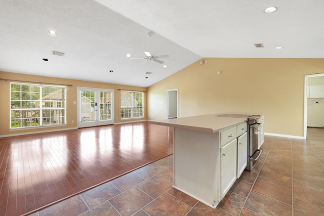 360 Holiday Ln, Coldspring, TX 77331 - kitchen with electric range, ceiling fan, open floor plan, baseboards, and lofted ceiling
