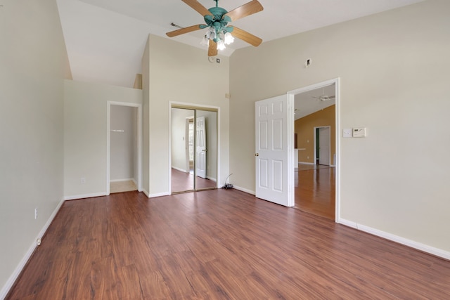 360 Holiday Ln, Coldspring, TX 77331 - unfurnished bedroom featuring wood finished floors, baseboards, high vaulted ceiling, a closet, and a ceiling fan