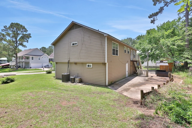360 Holiday Ln, Coldspring, TX 77331 - view of side of home with a yard, a patio, and stairs