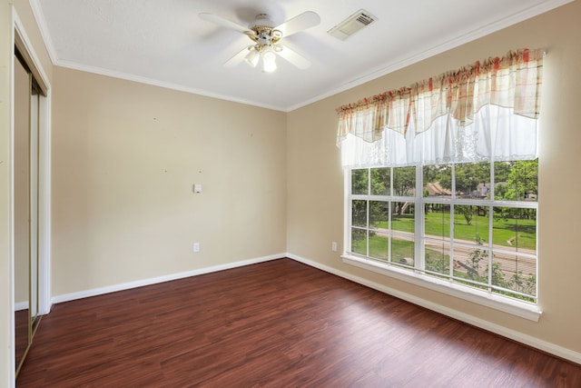 360 Holiday Ln, Coldspring, TX 77331 - unfurnished room featuring plenty of natural light, ceiling fan, crown molding, baseboards, and dark wood finished floors